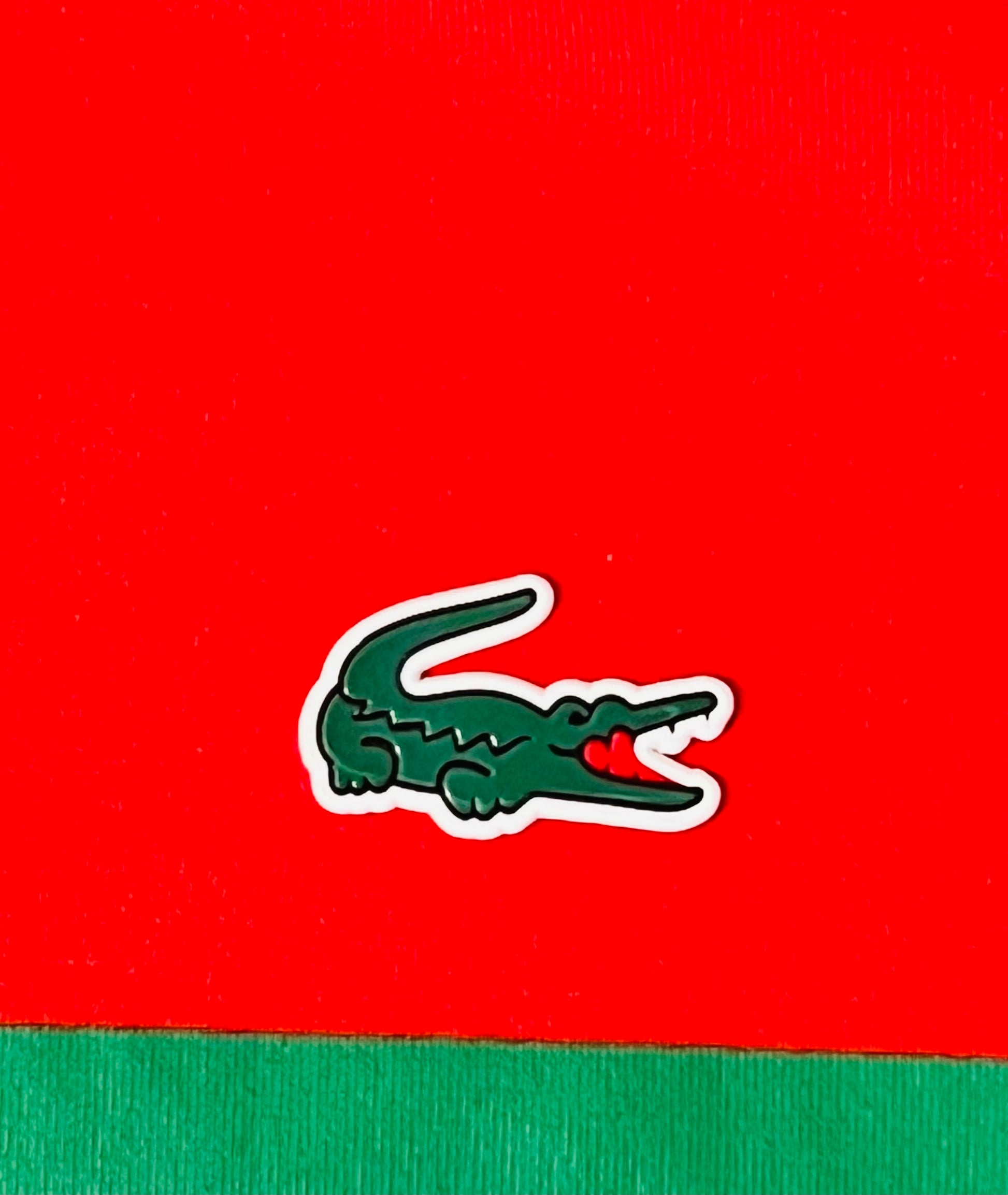 Close-up of Lacoste logo on a Lacoste red slim fit t-shirt with green detailing