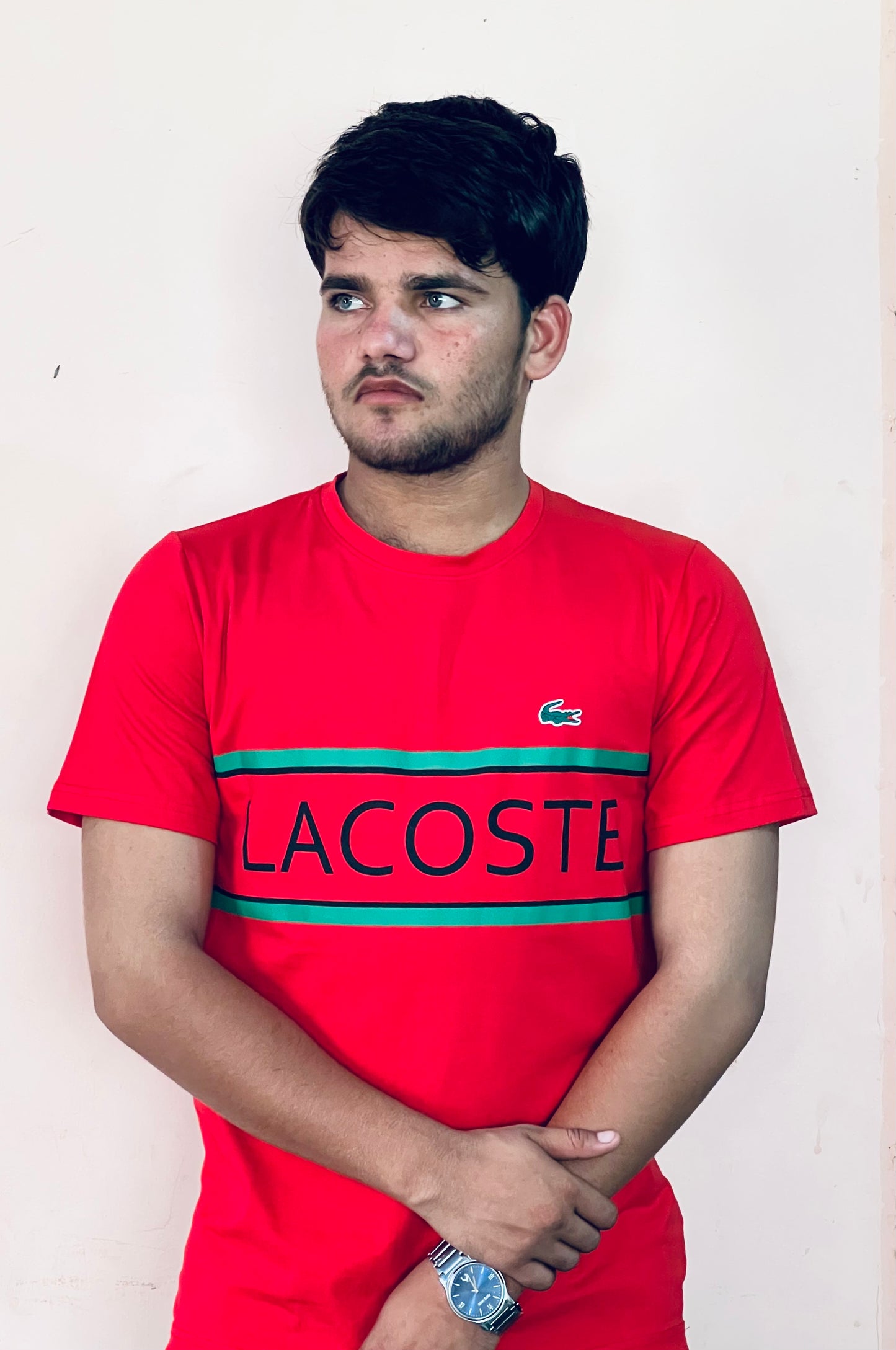 Man wearing Lacoste red slim fit t-shirt with logo and green stripes by Flaxwears